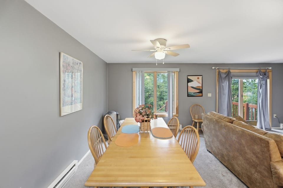 Share meals around the dining table, with leafy views and the living area close by. (Powder Pass)
