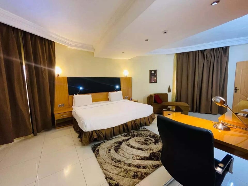 Economy Room, Balcony, City View | Desk, laptop workspace, blackout drapes, soundproofing