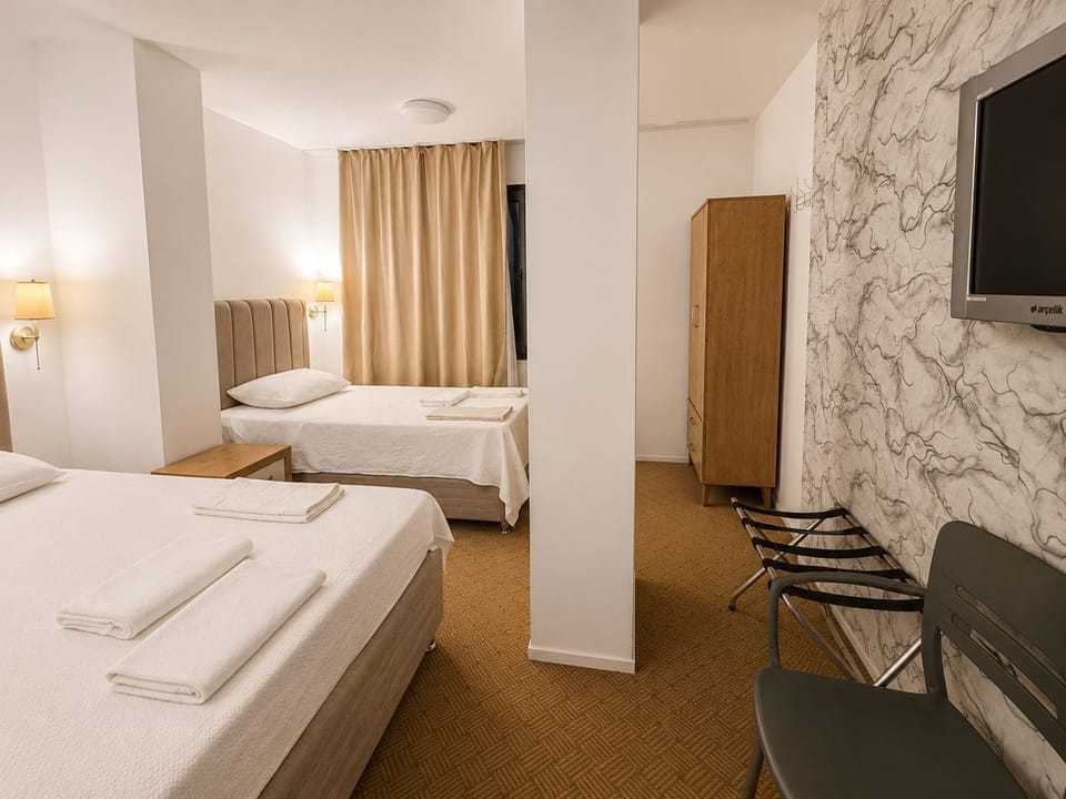 Classic Triple Room, City View | In-room safe, desk, laptop workspace, soundproofing