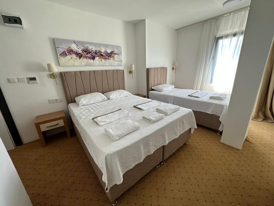 Classic Triple Room, City View | In-room safe, desk, laptop workspace, soundproofing