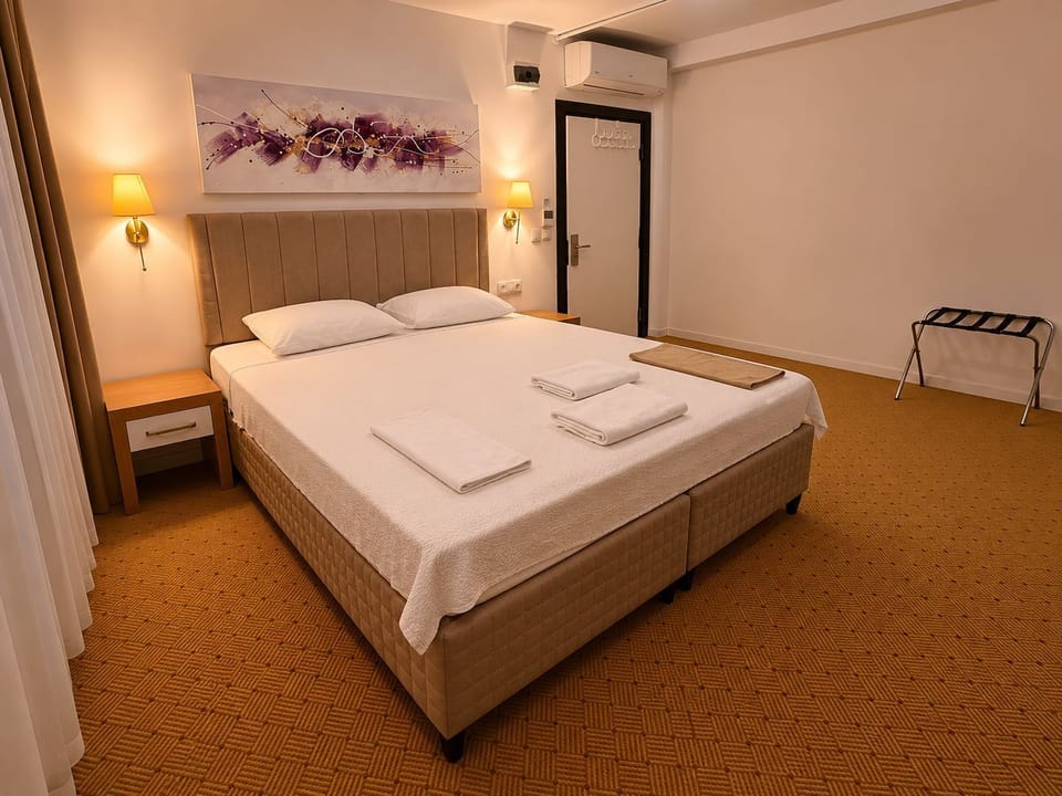 Family Suite, City View | In-room safe, desk, laptop workspace, soundproofing