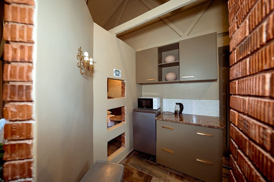Deluxe Double or Twin Room, Patio, Garden View | Private kitchen | Electric kettle