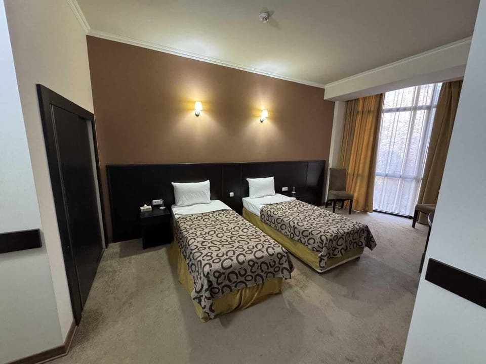 Double or Twin Room | In-room safe, iron/ironing board (on request), WiFi (free)