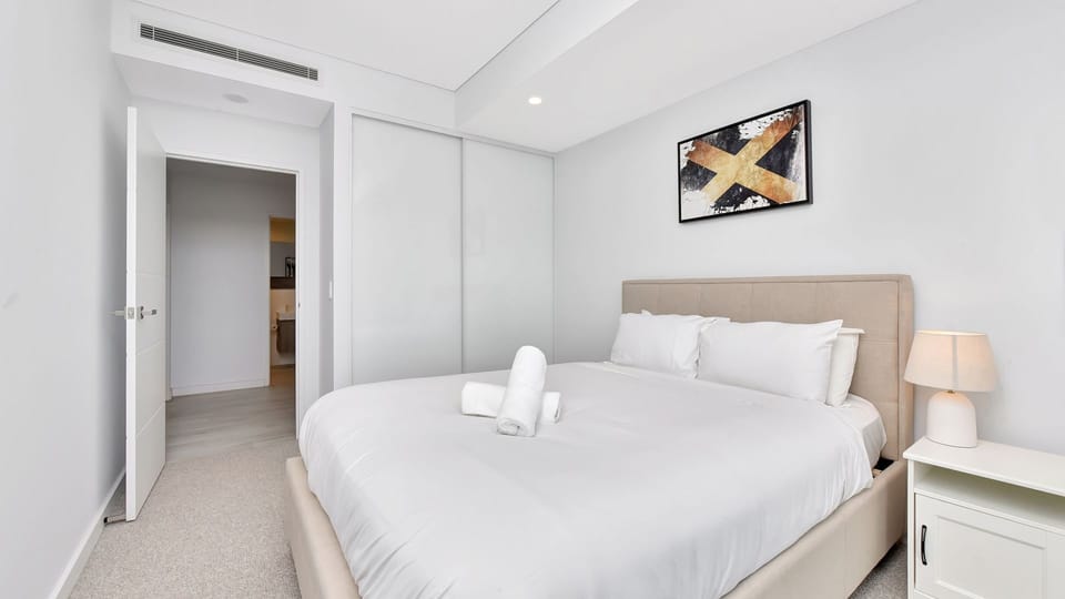 Bright second bedroom with quality linens.