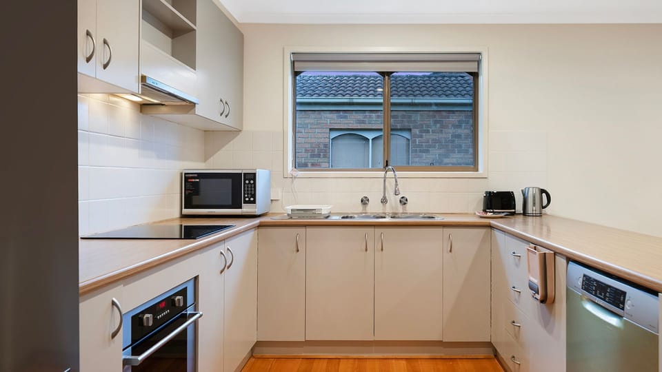 Well-appointed kitchen with modern appliances.