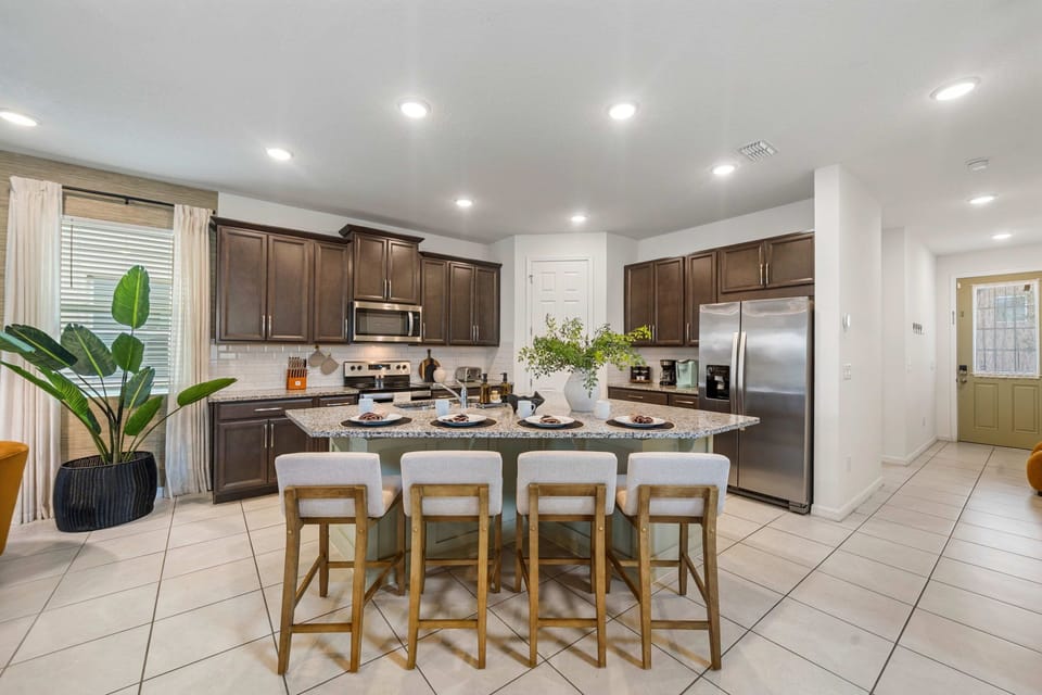 Large kitchen island with seating for casual meals and conversation.