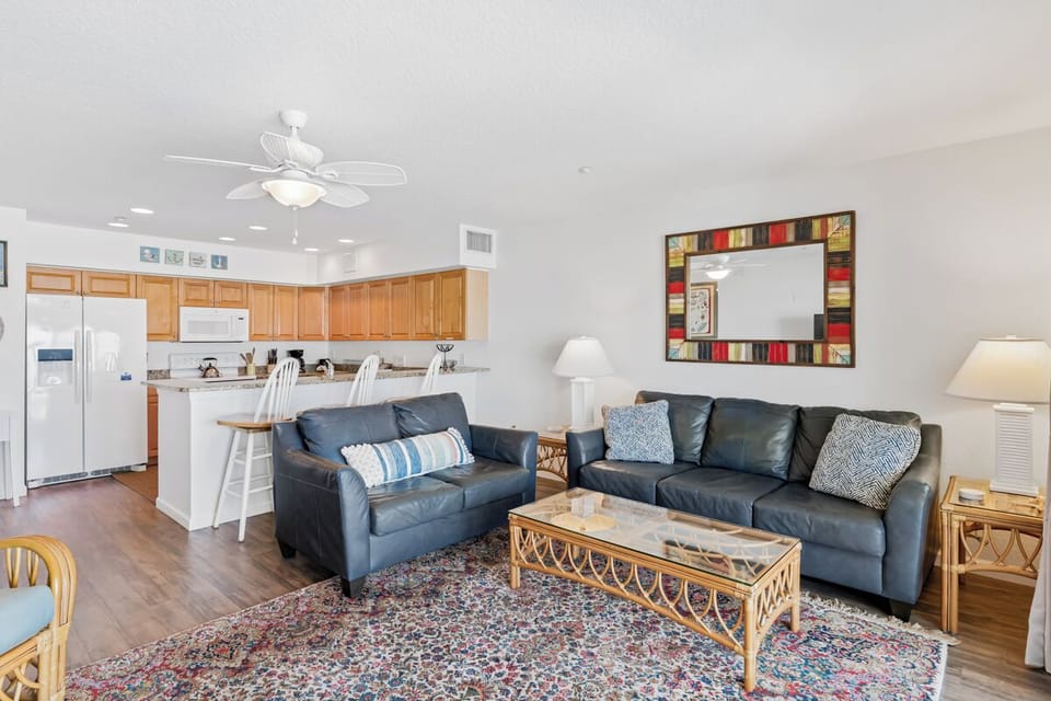 Relax in your spacious open-plan retreat with plush leather seating, fully equipped kitchen, and coastal-inspired decor that feels like home.