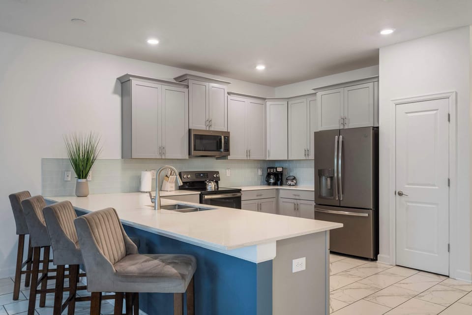 Create lifelong memories in this beautiful chef-inspired kitchen. Featuring modern appliances, ample seating, and an open layout, it's the perfect place for family and friends to cook, laugh, and enjoy quality time together.