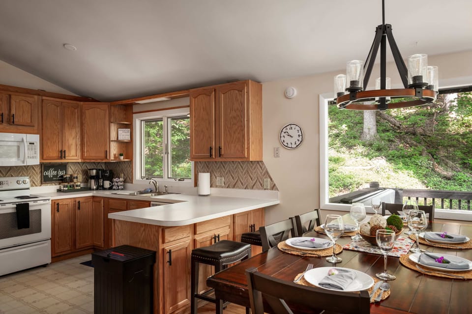Fully equipped kitchen with island seating and a coffee bar