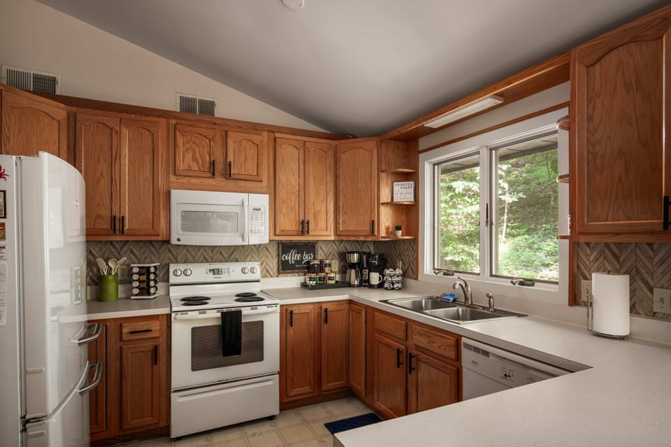 Bright kitchen with classic wood cabinetry and all the essentials