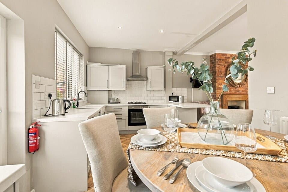 Open-plan dining area with breakfast bar overlooking the kitchen.
