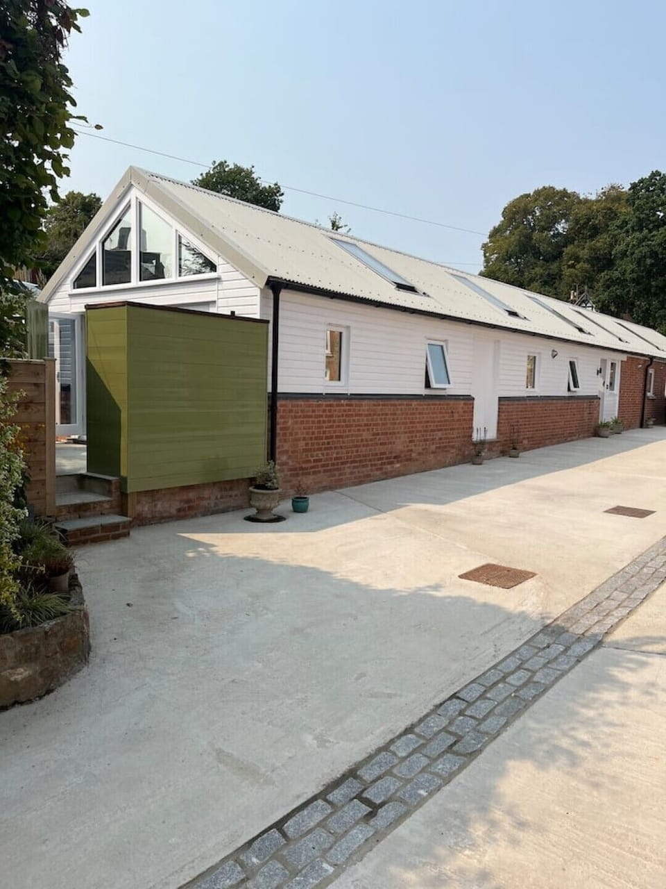 External view of the Cowshed and entry into patio