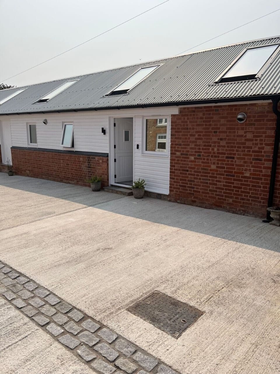 Front door access to the Cowshed with step.