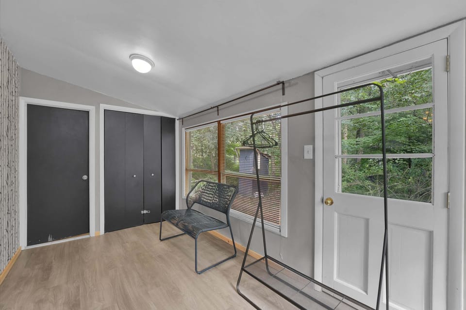 Hallway with birch-mural accent wall leading to the bedrooms