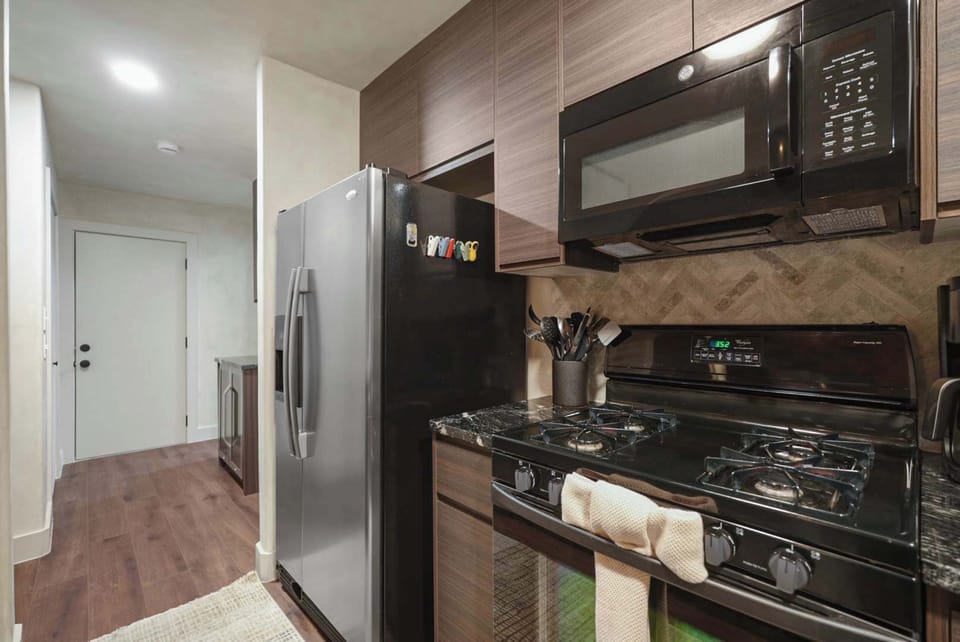 Sleek new finishes, updated appliances, and morning coffee prep.