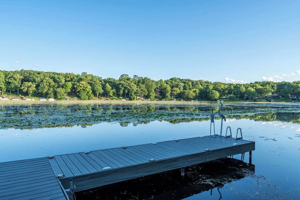 Private dock extending into calm Lauderdale Lakes water