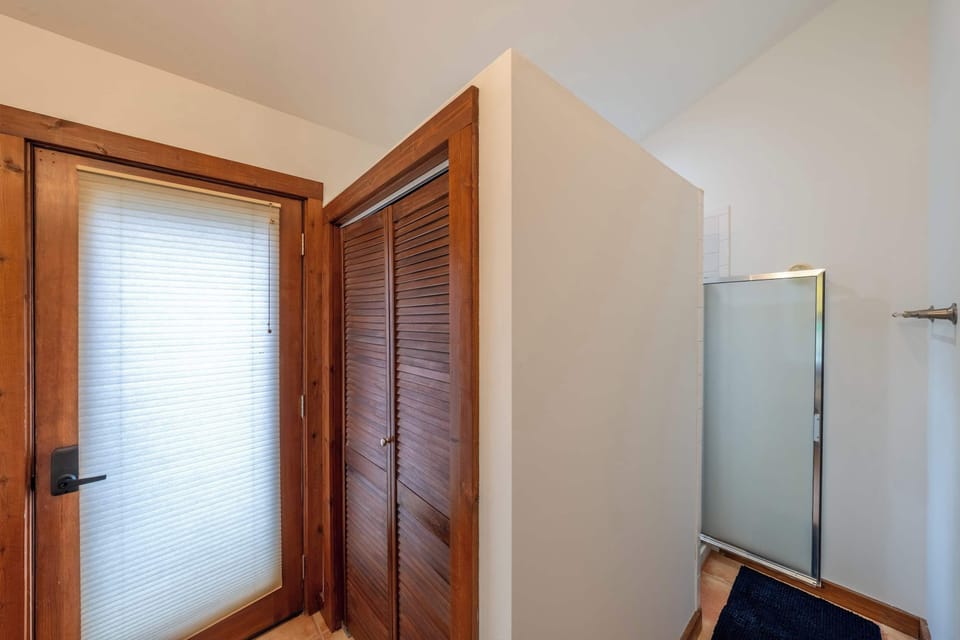 Close view of the spacious dual vanity and modern lighted mirrors