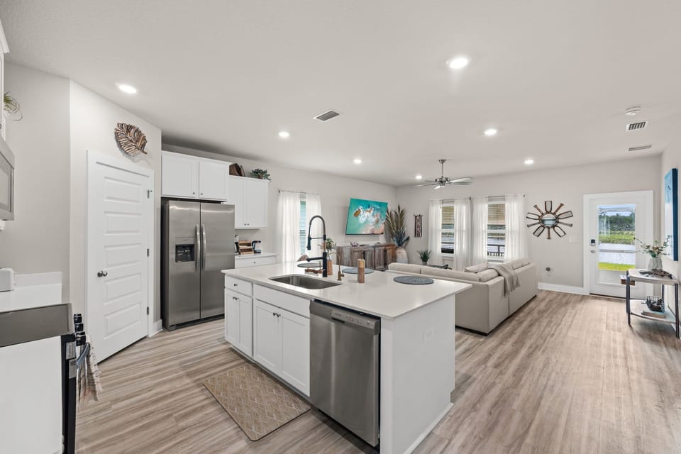 Spread out in this bright, open layout where your kitchen flows right into the living space. Stainless appliances, a spacious island, and plenty of natural light make cooking and gathering feel effortless and welcoming.