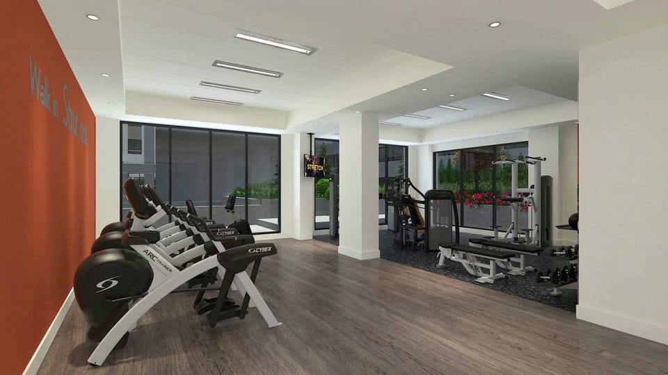 The fitness center has cardio machines and weights.