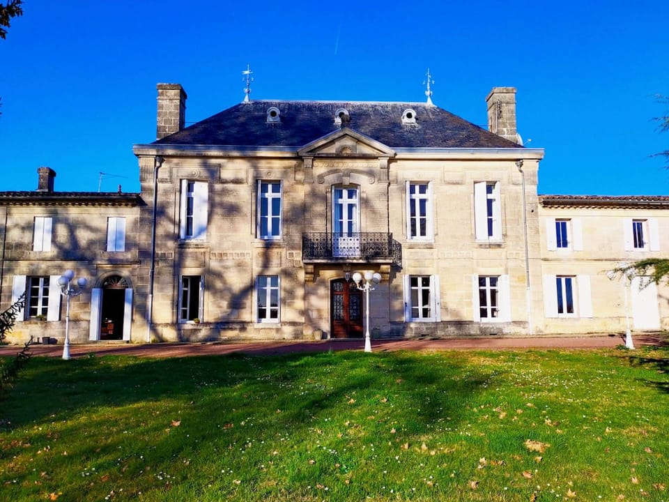 The château's limestone facade, typical of the Bordeaux region, sits on its 18-hectare estate in the Côtes de Bourg appellation.