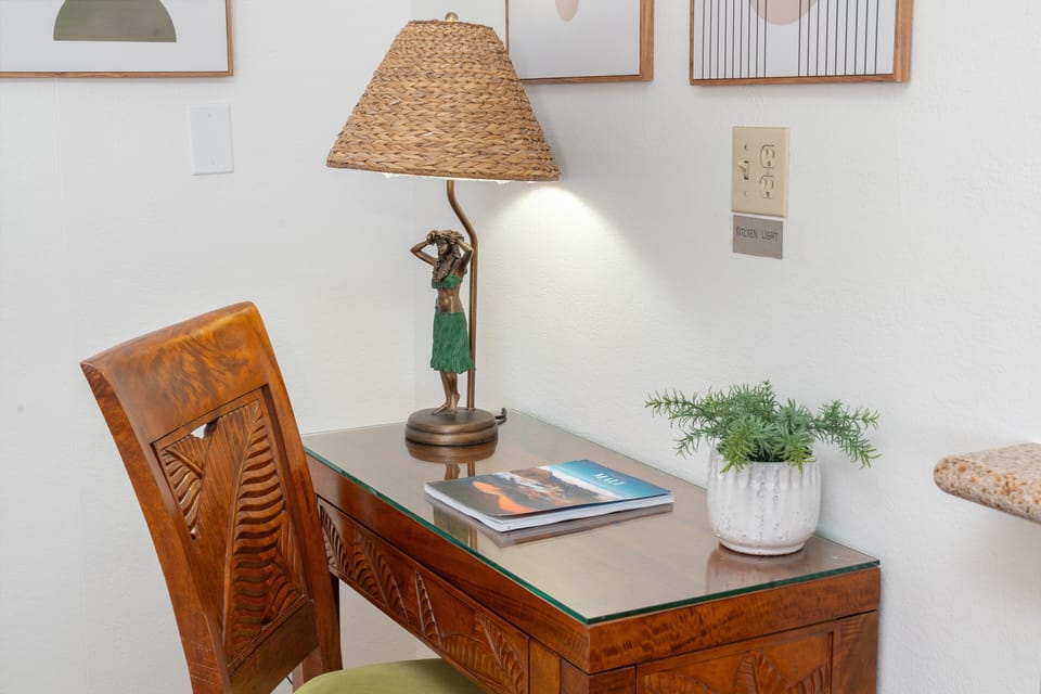 Dedicated workspace with a desk and task lighting, providing a convenient spot for remote work or trip planning.