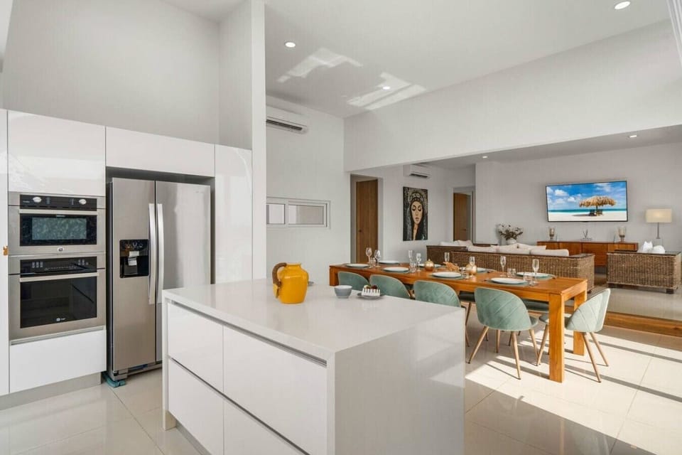 Prepare meals with sleek appliances, then gather around the welcoming dining area for relaxed breakfasts, family dinners, and memorable evenings together in Aruba.