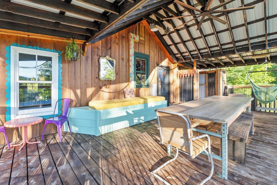 Deck with dining table, built-in bench, and outdoor shower