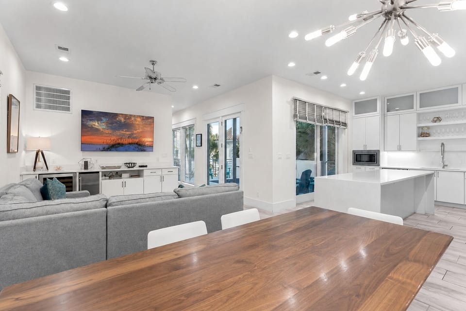 2nd Floor - Dining and living spaces flow together for shared meals, game nights, and relaxed group time near the private pool.