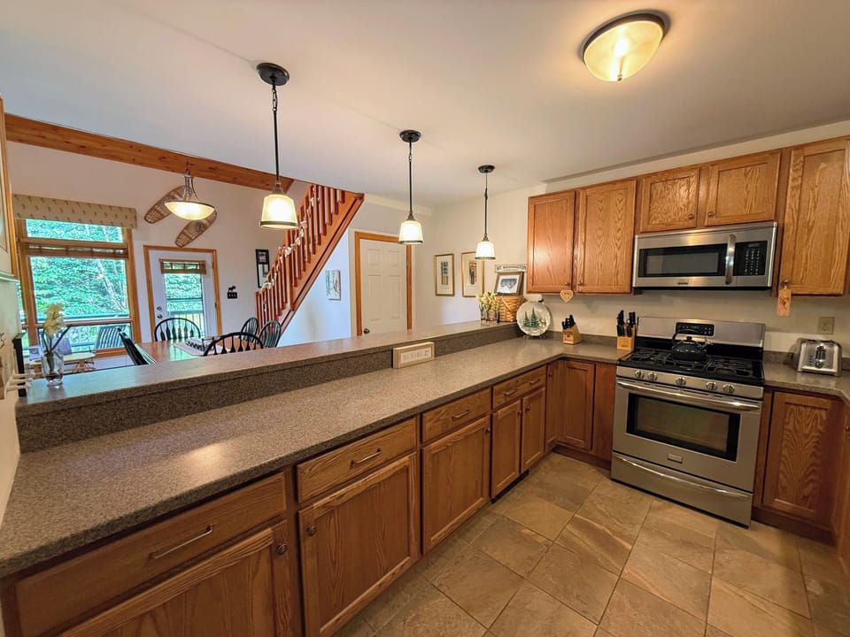 Lots of counter space and stainless steel appliances make this a very comfortable kitchen.