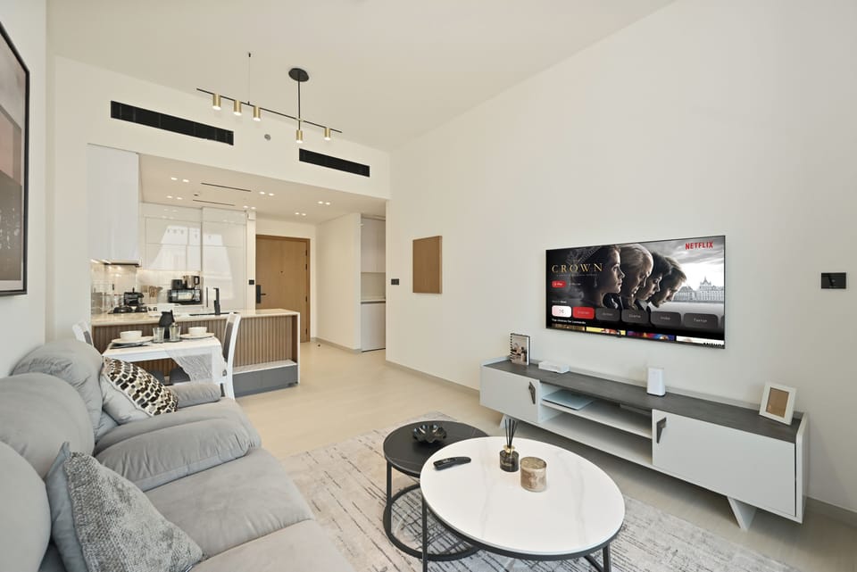 Apartment, Balcony | Living area | 55-inch Smart TV with satellite channels