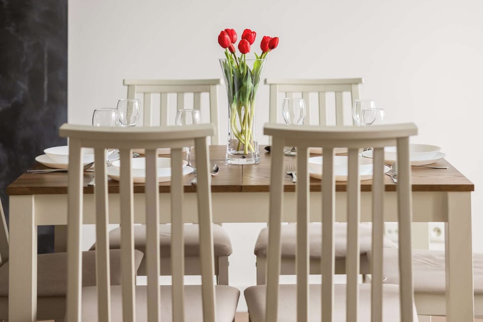 Bright dining space with modern furnishings and plenty of natural light.