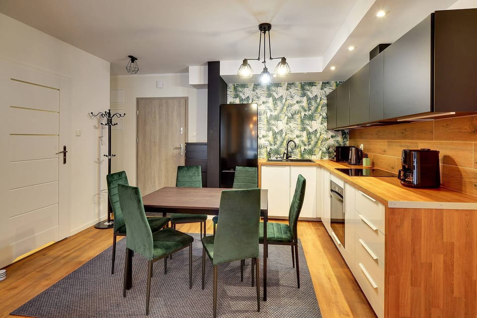 The sleek design of the kitchenette blending seamlessly with the living area.