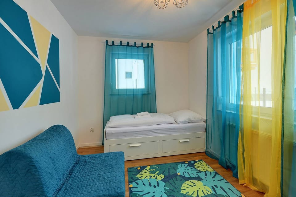 The bedroom's design ensures a comfortable stay. 