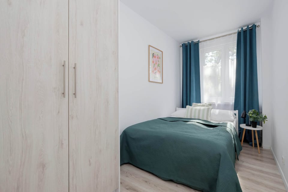 Cozy bedroom with comfortable double bed, soft textiles, and calming décor.