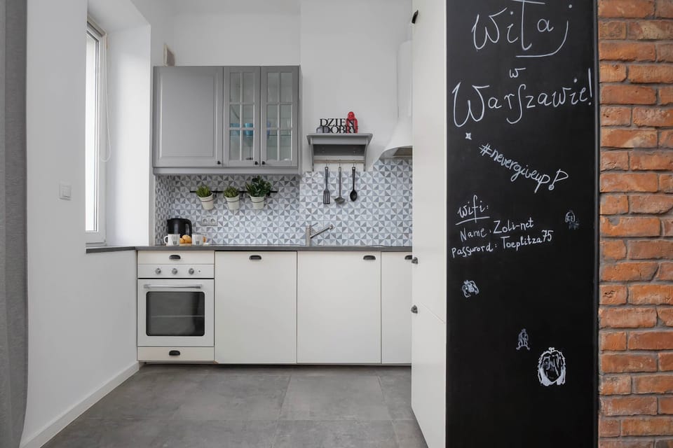 A fully equipped kitchen with modern appliances and plenty of workspace for preparing meals. Everything you need for a comfortable stay is within easy reach.