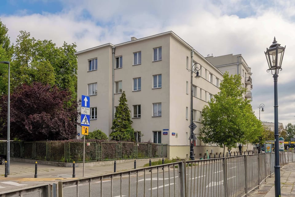 The apartment is located in a well maintained residential building surrounded by greenery. The neighborhood is peaceful and convenient for everyday stays.