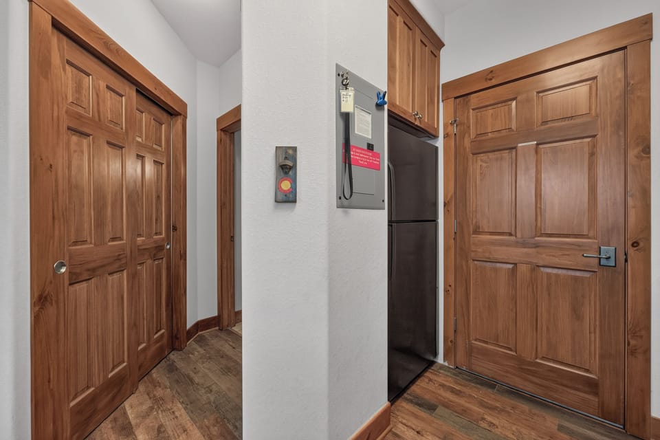 Step inside to find a well-appointed entryway with warm wood finishes and modern conveniences, including an elevator for easy access throughout your stay.