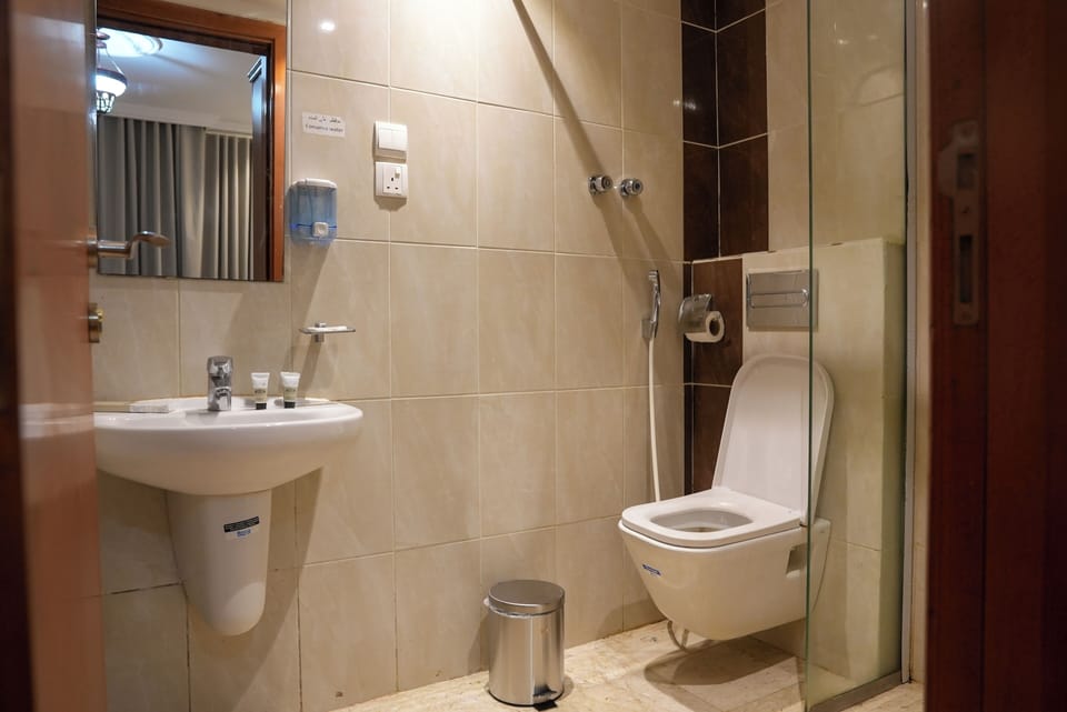 Hair dryer, slippers, towels, soap