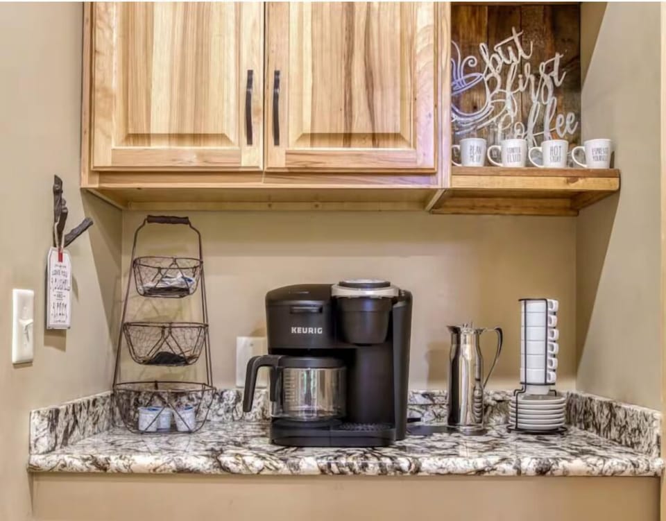 Charming coffee station with granite counters and rustic touches