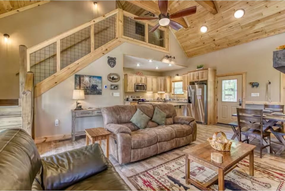 Rustic great room with loft, vaulted ceilings, and open kitchen