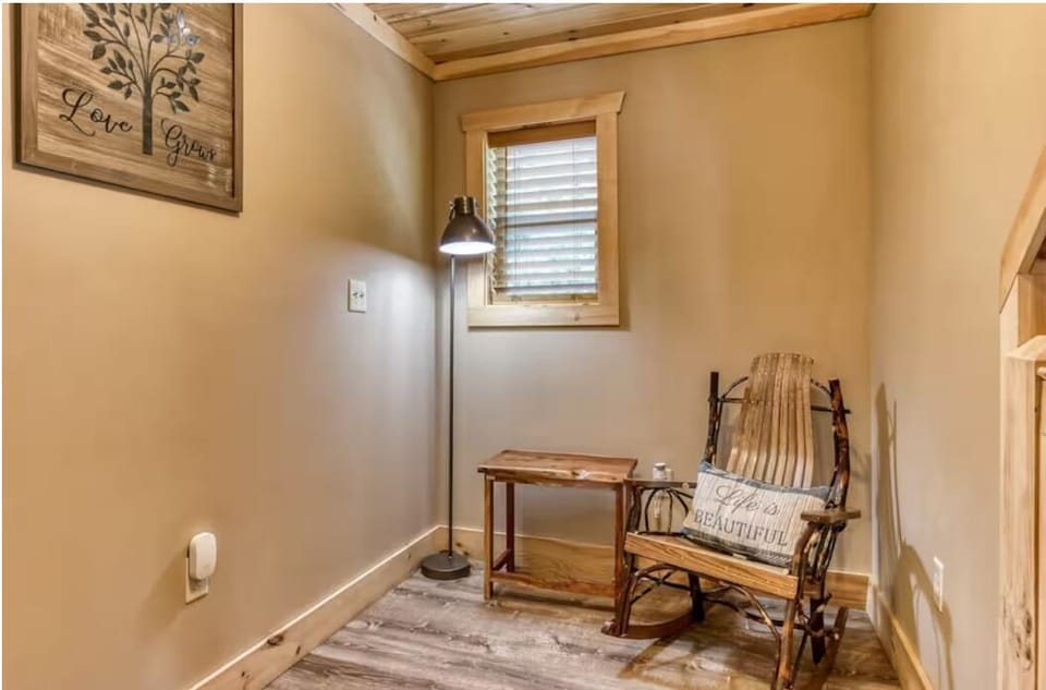 Cozy rustic reading nook with rocking chair and warm cabin charm
