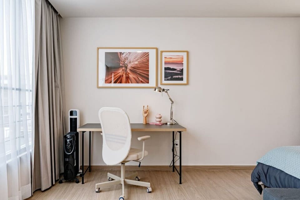 Dedicated workspace with a desk, ergonomic chair in bedroom 4.