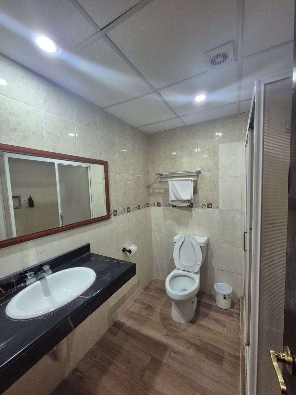Separate tub and shower, towels, soap, shampoo