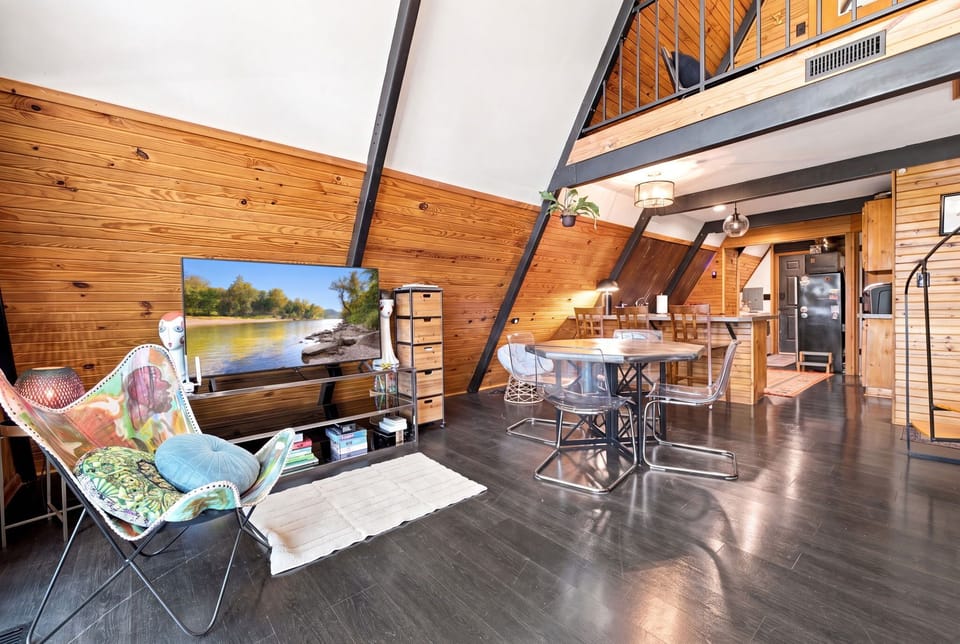 When you walk into our A-frame home, you'll discover an open-concept living room and kitchen that creates the ideal setting for memorable gatherings
