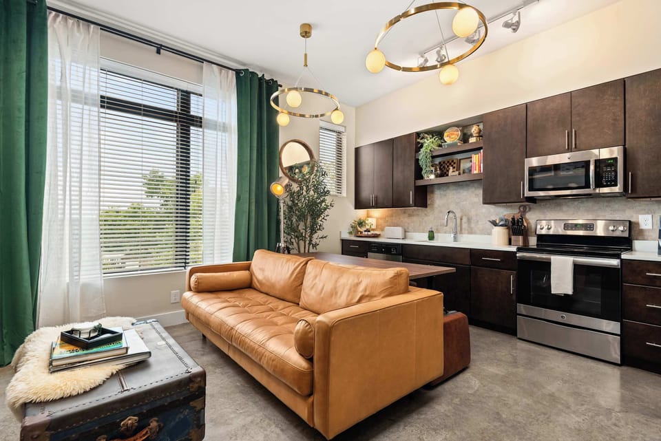 Sofa and coffee table with the kitchen a step away