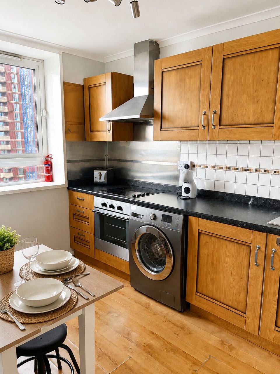 Kitchen appliances including oven, hob, washing machine and coffee maker
