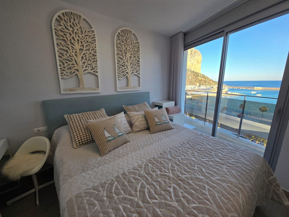 king bed with beach and mountain view