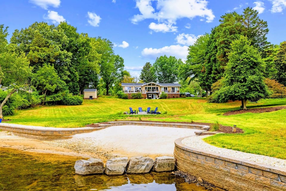 Backyard & Beach - Stone-edged shoreline and a sandy beach step right down to the water.