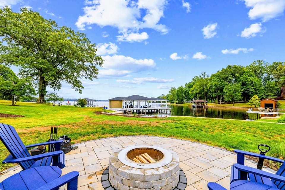 Fire Pit - A custom stone fire pit on the water's edge, where the evening keeps going long after sunset.