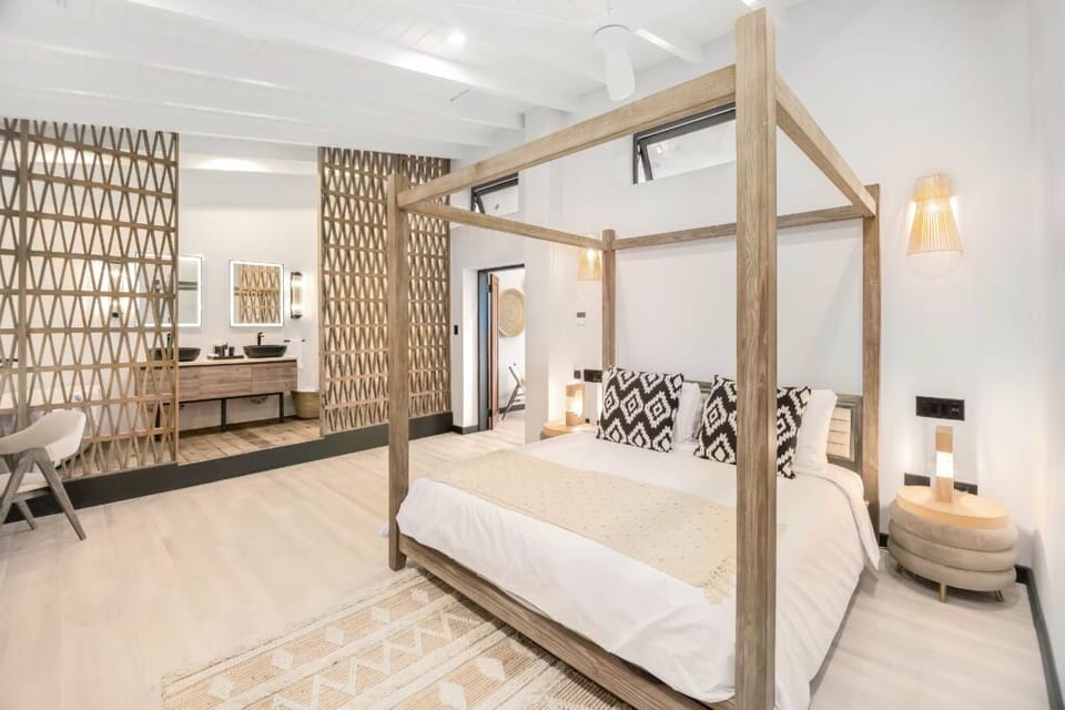 Drift off beneath the airy canopy in serene style.